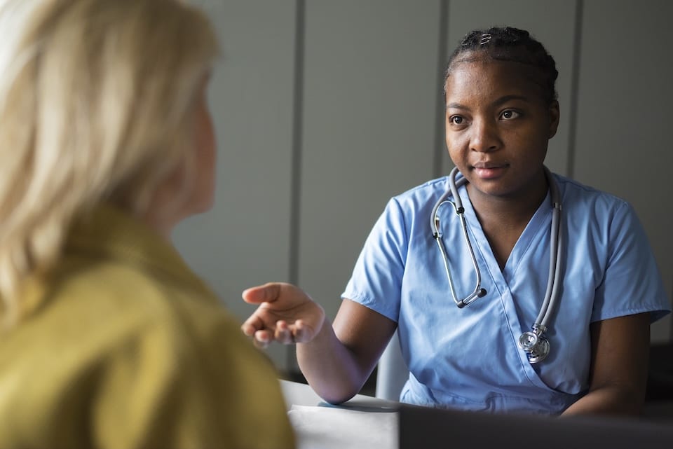 Healthcare professional talking with a patient
